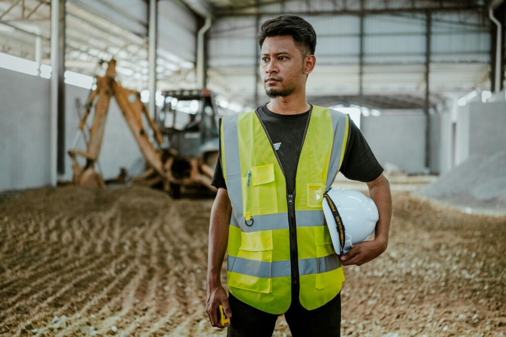 Construction supervisor reviewing plans on a worksite
