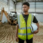 Construction supervisor reviewing plans on a worksite