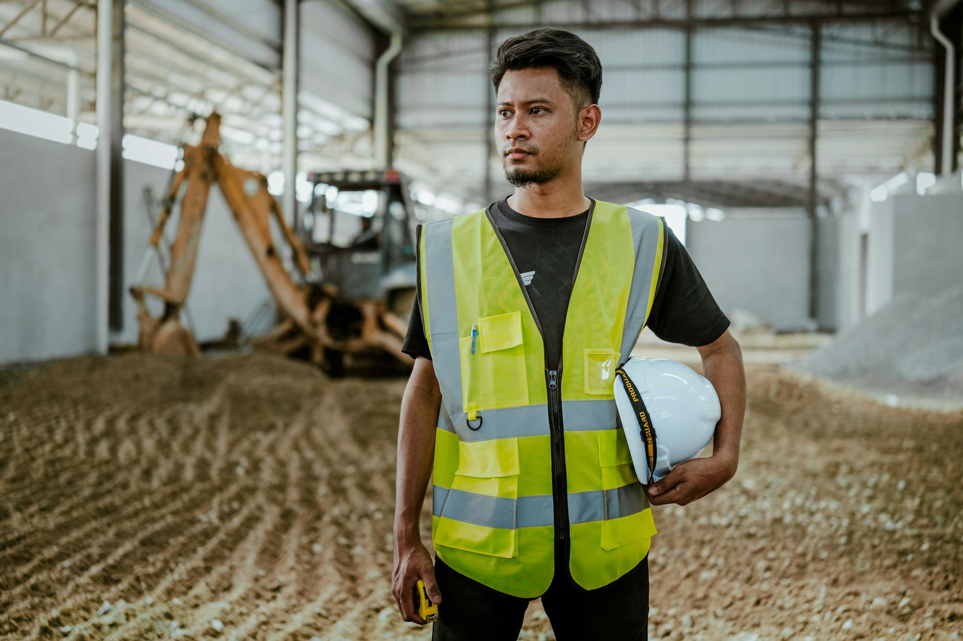 Construction supervisor reviewing plans on a worksite