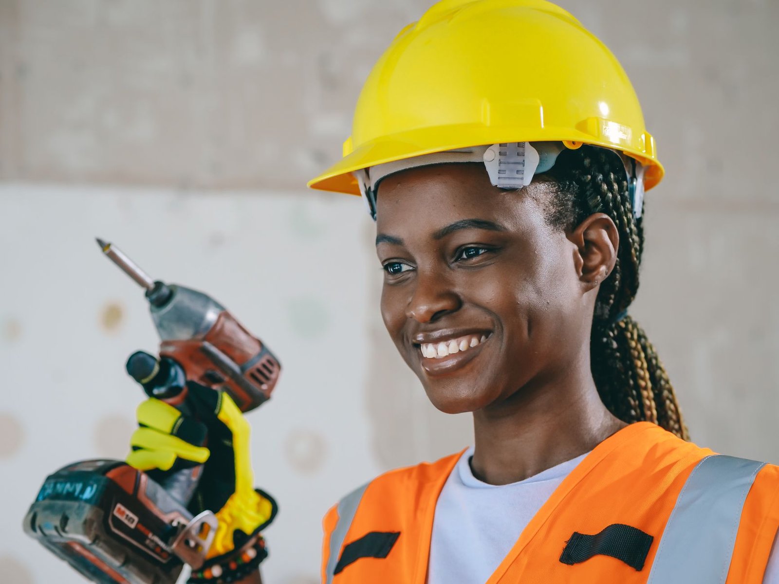 An apprentice being shown a task on a construction site