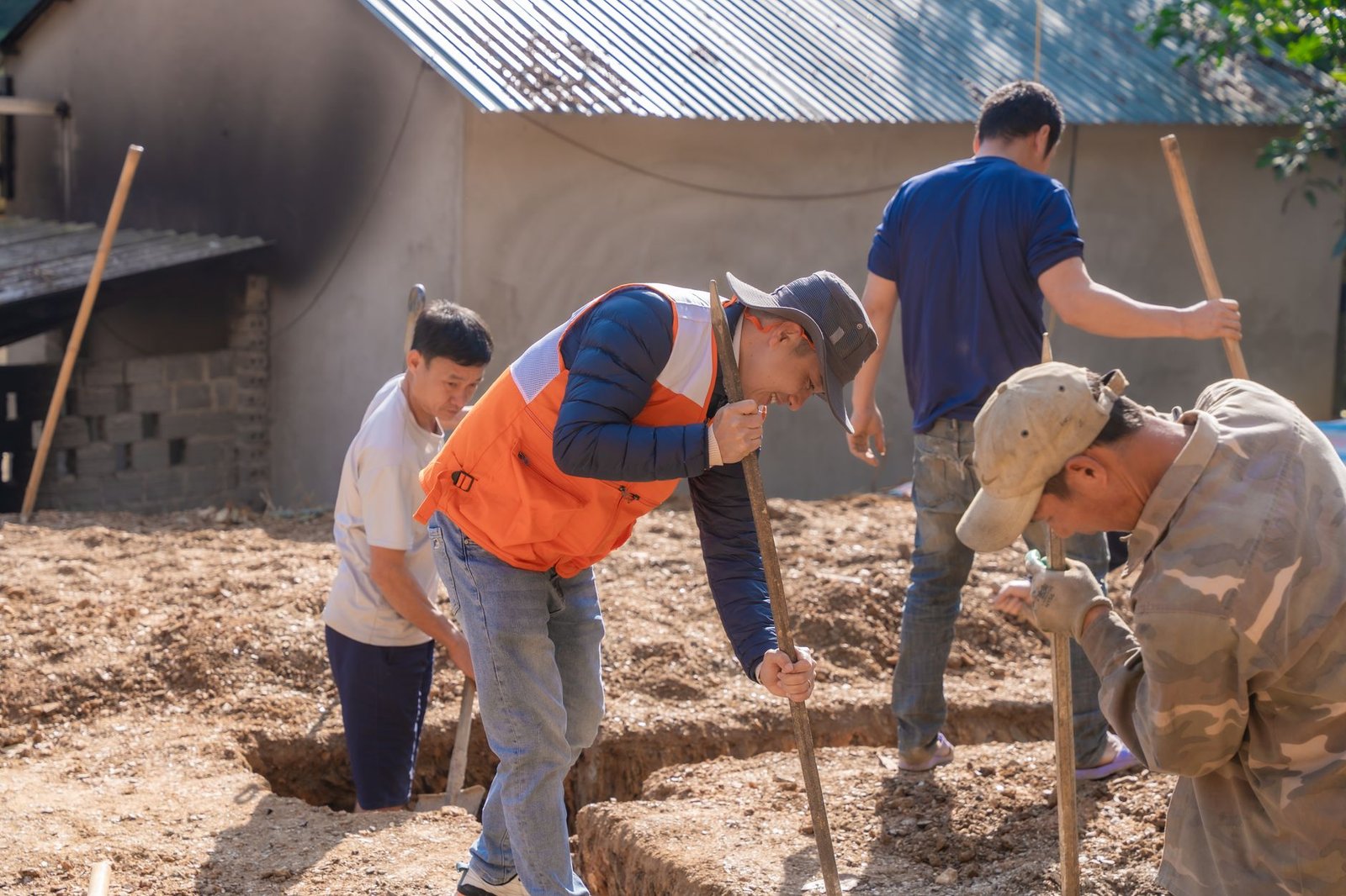 A construction crew working independently across a work front