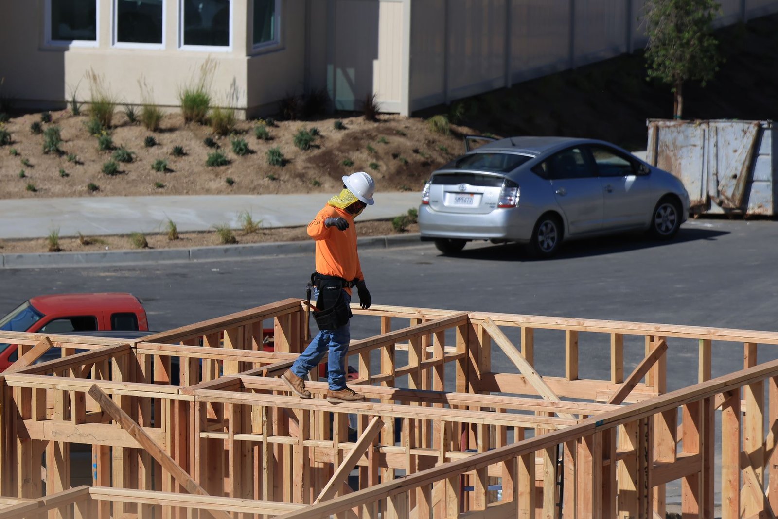 A construction worker leaving site at the end of a shift