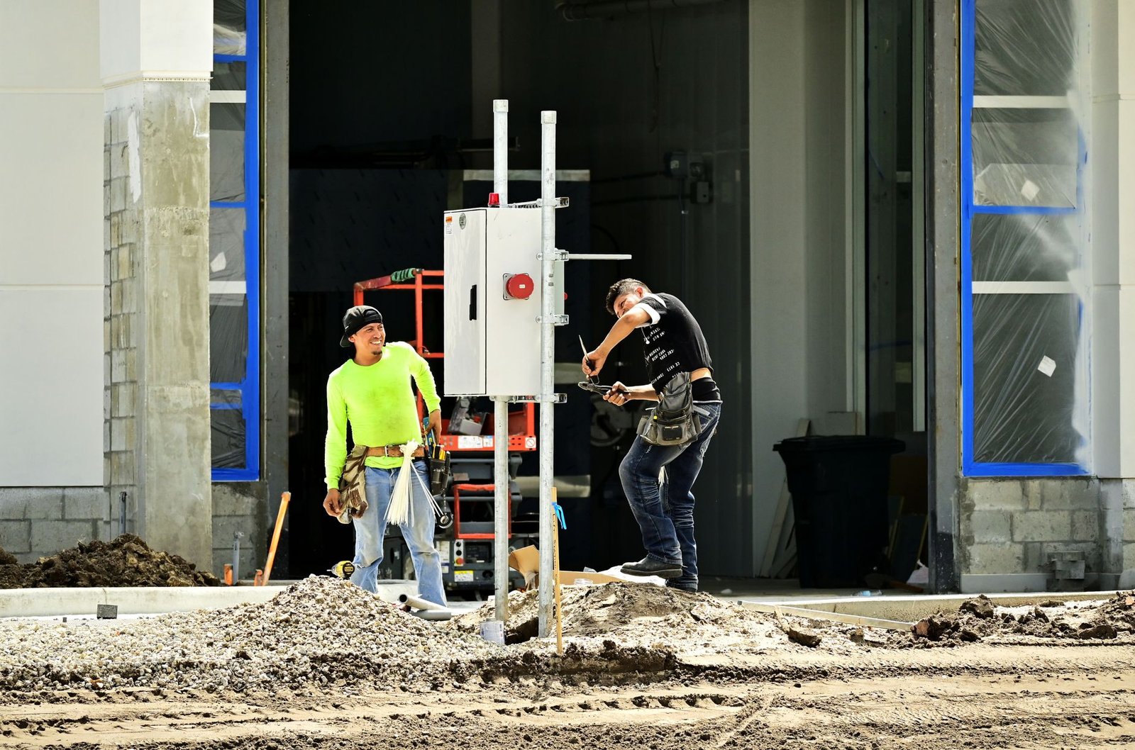 A construction worker packing up tools at the end of a shift
