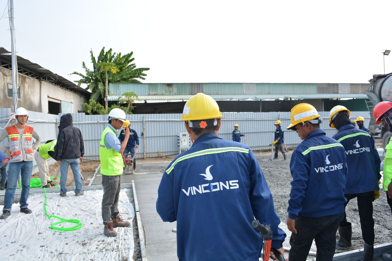 A construction crew listening during an on-site briefing