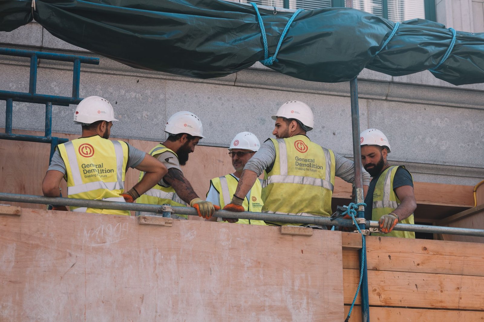 A mixed construction crew working across a busy site