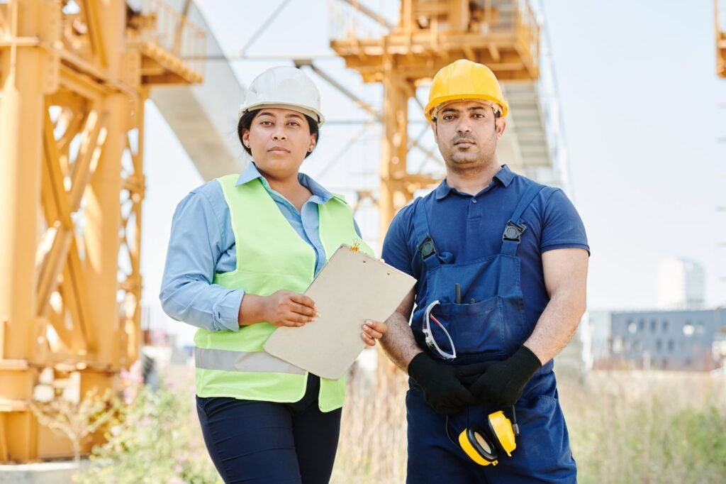 A mixed construction crew working together on site